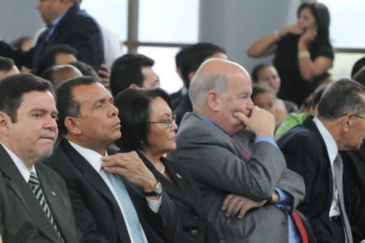 (From L) Supreme Court of Justice President Jorge Aviles, Honduran President Porfirio Lobo and OAS Secretary General Jose Miguel Insulza attend the ceremony during which the coordinator of the Commission for the Truth and the Reconciliation, Guatemalan Eduardo Stein, handed on their final report on the facts related to the coup that ousted president Manuel Zelaya, in Tegucigalpa, on July 7