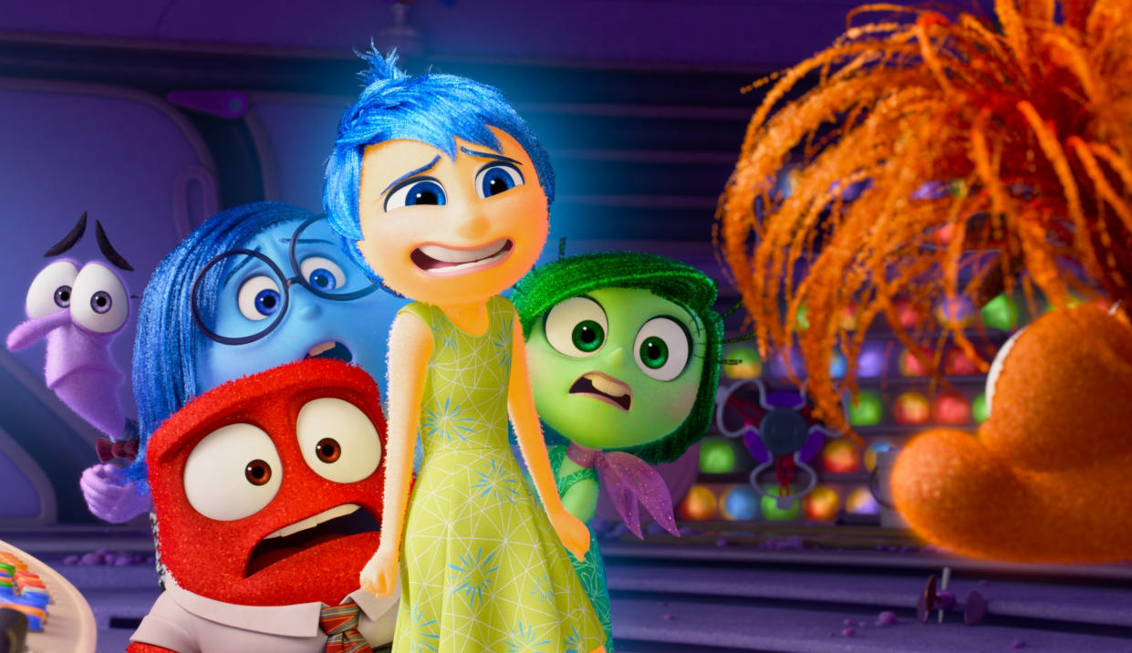  Inside Out 2 emotions looking scared as they meet a new character. 
