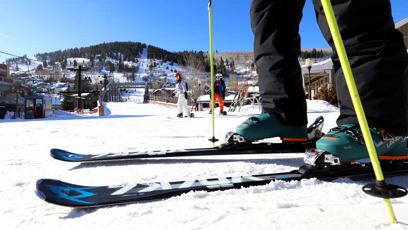 Skiers and snowboarders move to get on a lift in Park City on Tuesday, Jan. 11, 2022.