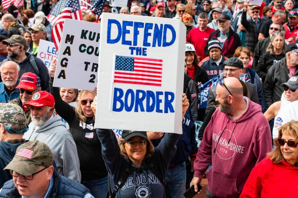 PHOTO: People hold signs and flags at a 'close the border' rally in Boston, MA, May 4, 2024.  (Joseph Prezioso/AFP via Getty Images)