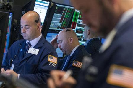 Traders work on the floor of the New York Stock Exchange May 16, 2014. REUTERS/Brendan McDermid