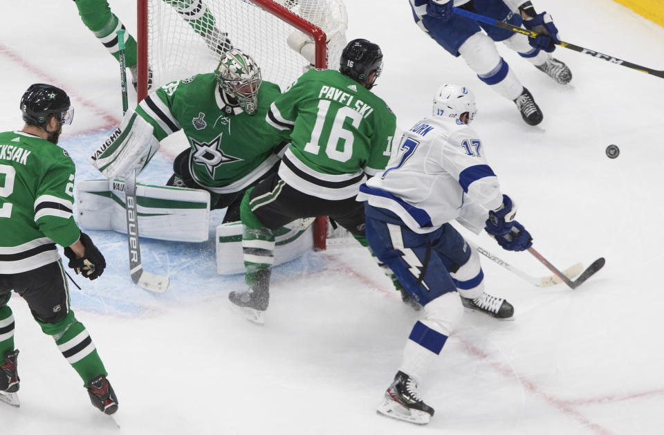 Tampa Bay Lightning's Alex Killorn (17) is stopped by Dallas Stars' goalie Anton Khudobin (35) as Stars' Joe Pavelski (16) defends during second-period NHL Stanley Cup finals hockey game action in Edmonton, Alberta, Monday, Sept. 28, 2020. (Jason Franson/The Canadian Press via AP)