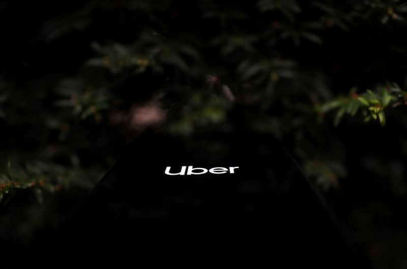 FILE PHOTO: The Uber logo is displayed on a mobile phone in this picture illustration