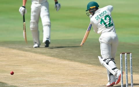 Quinton de Kock drives - Credit: AFP