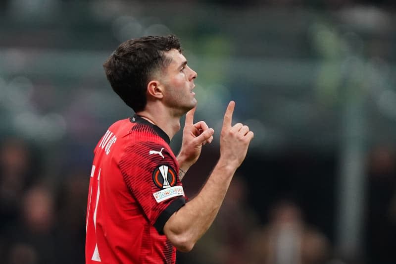 AC Milan's Christian Pulisic celebrates scoring his side's fourth goal during the UEFA Europa League round of 16 first leg soccer match between Ac Milan and SK Slavia Prague at San Siro Stadium. -/LaPresse via ZUMA Press/dpa