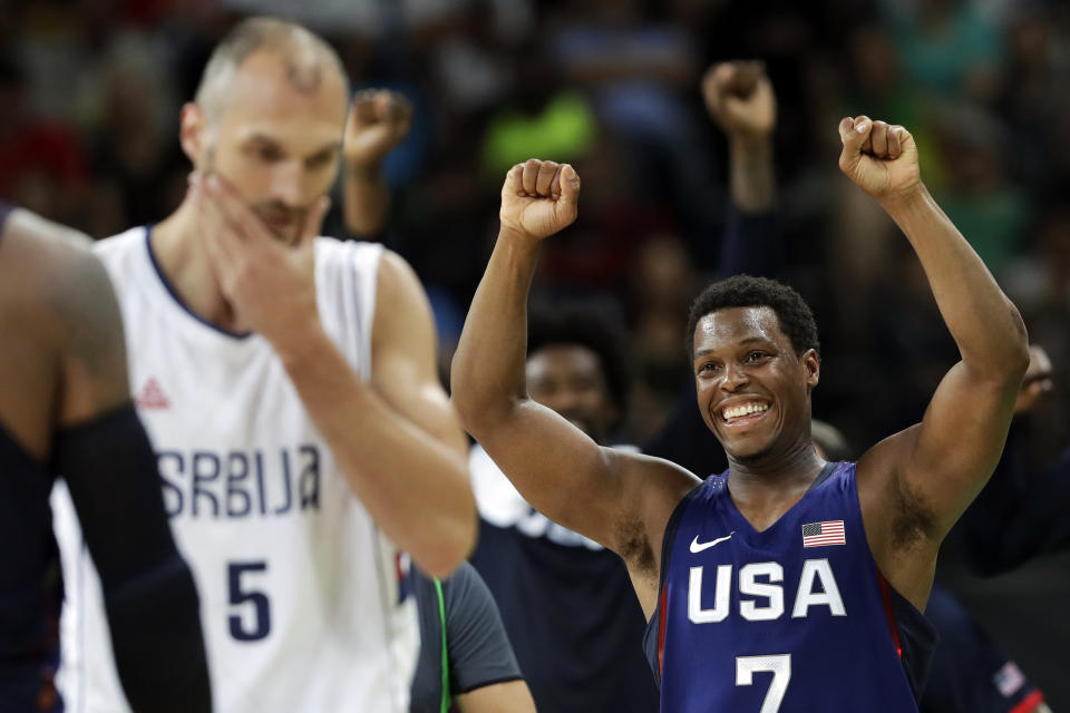 FILE - In this Aug. 21, 2016, file photo, United States' Kyle Lowry (7) celebrates near Serbia's Marko Simonovic (5) in the men's gold medal basketball game at the 2016 Summer Olympics in Rio de Janeiro, Brazil. Lowry has spent an extended stretch away from home during the summer. While unprecedented as part of an NBA season, it isn’t exactly a foreign concept for those with USA Basketball experience like the Olympics and the World Cup.(AP Photo/Eric Gay, File)