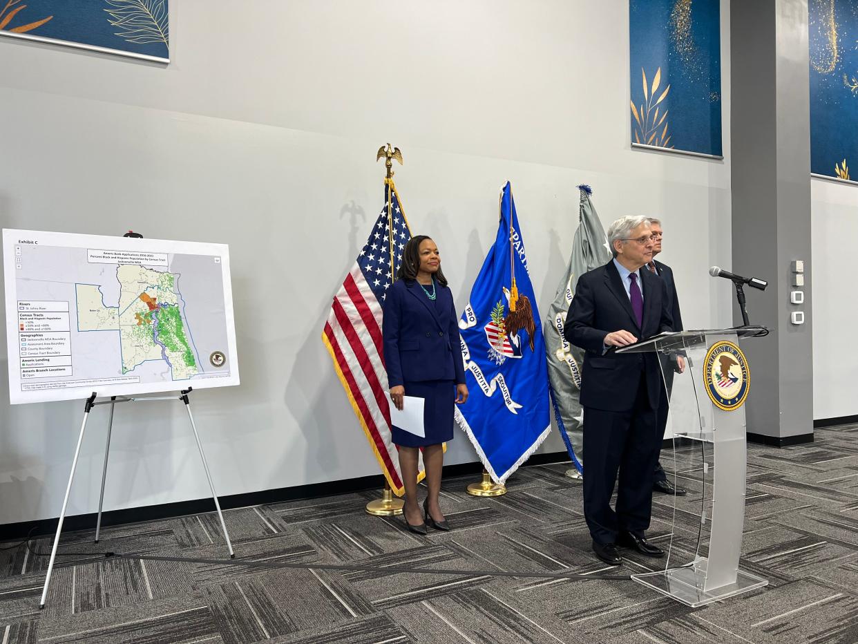 Assistant Attorney General Kristen Clarke of the Civil Rights Division (center) announced a redlining case settlement with Ameris Bank in Jacksonville Thursday, Oct. 19, 2023, alongside Attorney General Merrick B. Garland (left).