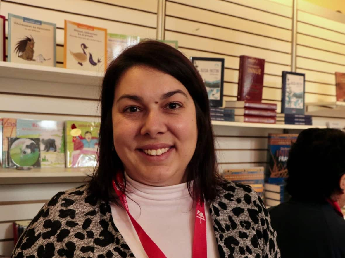 Marie-Pier Carré works for the Tshakapesh Institute and was at Quebec City's Morrin Centre on Friday. Along with community organizations, over two dozen authors from across Turtle Island are gathering this weekend for the 11th edition of a book festival celebrating Indigenous storytelling.   (CBC/Rachel Watts - image credit)