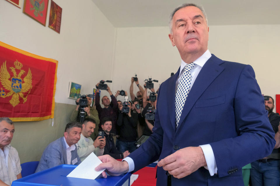 Pro-Western incumbent Milo Djukanovic casts his ballot at a polling station in Montenegro's capital Podgorica, Sunday, April 2, 2023. Montenegrins are casting ballots on Sunday in a runoff presidential election that is a battle between a long-serving pro-Western incumbent and a newcomer promising changes in the small NATO member state in Europe that has been locked in political turmoil. (AP Photo/Risto Bozovic)