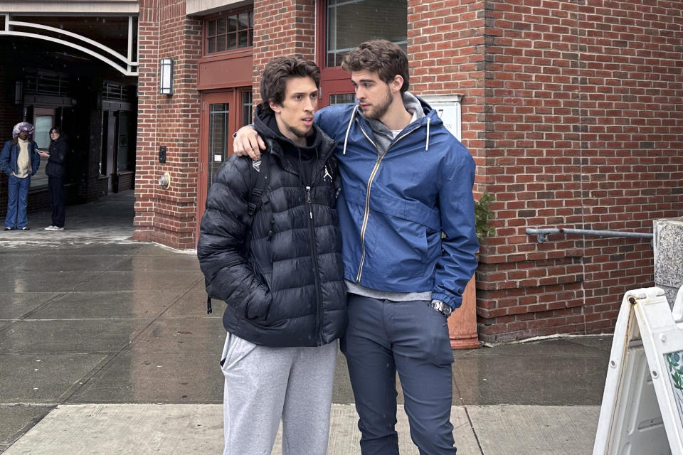 Dartmouth basketball players Romeo Myrthil, left, and Cade Haskins talk after voting at Dartmouth College in Hanover, N.H., Tuesday, March 5, 2024. Dartmouth basketball players vote Tuesday on whether to form a union.(AP Photo/Jimmy Golen)