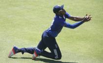 England's Chris Jordan takes a catch to dismiss South Africa's AB de Villiers during their second One-Day International cricket match in Port Elizabeth, February 6, 2016. REUTERS/Mike Hutchings