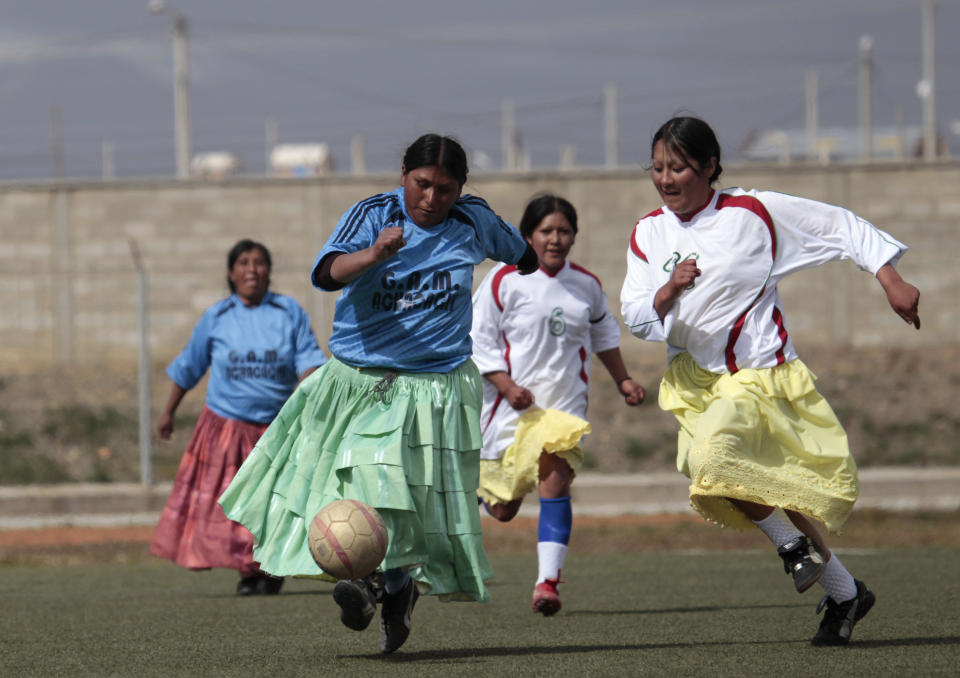 Lidia Mamani of the indigenous women's soccer team of the highland town Achacachi controls the ball during a match against the Batallas team at the Cosmos 78 Stadium in El Alto April 9, 2011. The team from Batallas played against the Achacachi team for the first time on Saturday. Both towns are located near to the Titicaca lake, some 3800 meters above sea level.  REUTERS/David Mercado    (BOLIVIA - Tags: SPORT SOCCER SOCIETY)