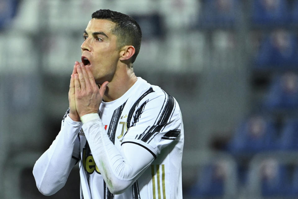 Juventus' Portuguese forward Cristiano Ronaldo reacts after missing a goal opportunity during the Italian Serie A football match Cagliari vs Juventus on March 14, 2021 at the Sardegna Arena in Cagliari. (Photo by Alberto PIZZOLI / AFP) (Photo by ALBERTO PIZZOLI/AFP via Getty Images)