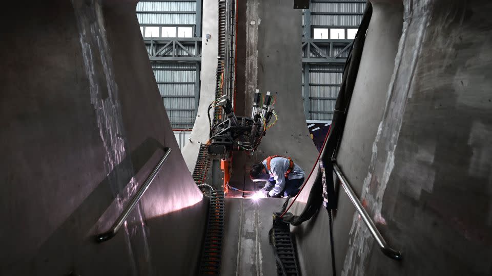 A worker welds parts together at the CRAFT fusion research park in Hefei, eastern China, in September 2023. The BEST tokamak will be built next to CRAFT. - Xinhua/Shutterstock