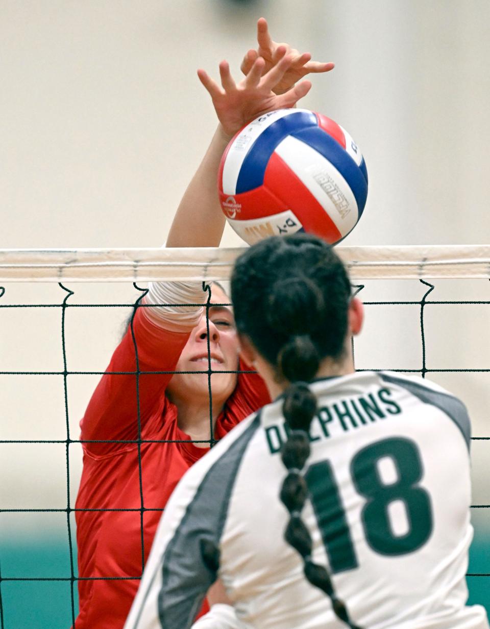 Dylan Andrews of Barnstable blocks the ball from Mariah Eaton of D-Y girls volleyball.
