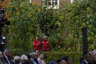 Rescue workers watch a ceremony where King Willem-Alexander officially unveiled a new monument in the heart of Amsterdam's historic Jewish Quarter on Sunday, Sept. 19, 2021, honoring the 102,000 Dutch victims of the Holocaust. Designed by Polish-Jewish architect Daniel Libeskind, the memorial is made up of walls shaped to form four Hebrew letters spelling out a word that translates as "In Memory Of." The walls are built using bricks each of which is inscribed with the name of one of the 102,000 Jews, Roma and Sinti who were murdered in Nazi concentration camps during World War II or who died on their way to the camps. (AP Photo/Peter Dejong)