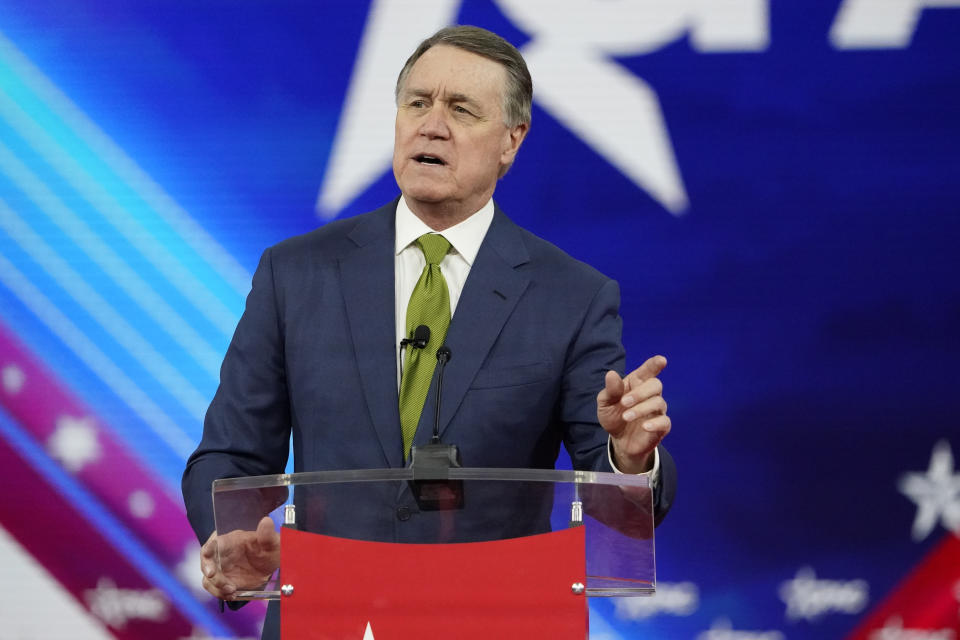 FILE - Former Sen. David Perdue R-Ga., speaks at the Conservative Political Action Conference (CPAC) Sunday, Feb. 27, 2022, in Orlando, Fla. A planned $5 billion electric vehicle plant that has been billed as the largest economic development project in Georgia’s history is drawing opposition from an unusual source: former Republican U.S. senator Perdue. A former corporate executive, Perdue is looking to unseat Georgia Gov. Brian Kemp, a fellow Republican, in this year’s gubernatorial race. (AP Photo/John Raoux, File)