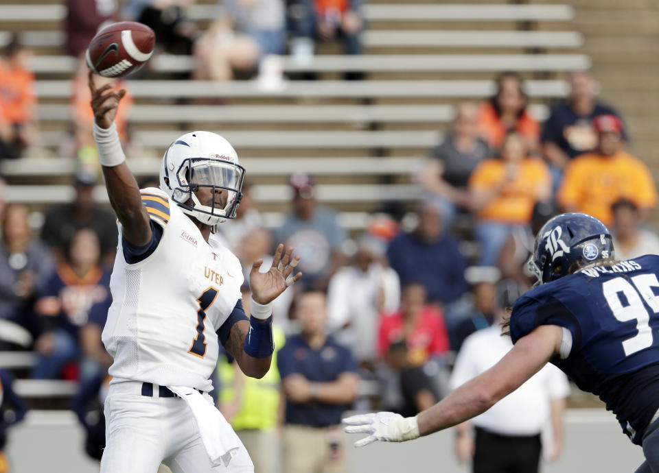 UTEP quarterback Kai Locksley (1) passes the ball under pressure from Rice defensive tackle Roe Wilkins (95) during the second half of an NCAA college football game Saturday, Nov. 3, 2018, in Houston. (AP Photo/Michael Wyke)