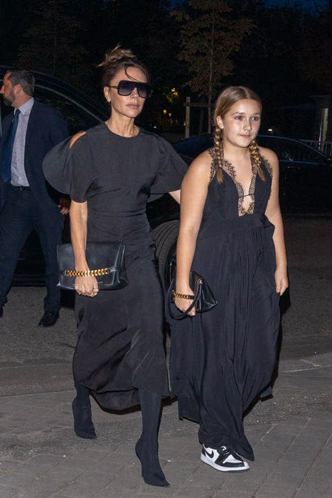 Victoria and Harper Beckham dressed in black