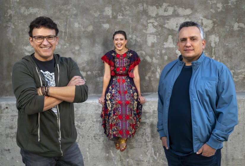 LOS ANGELES, CA - NOVEMBER 25, 2020: Left to right-Anthony Russo, his sister, Angela Russo-Otstot, and brother Joe Russo are photographed outside AGBO Studios in Los Angeles. The Russo brothers directed the movie, Cherry, with the script being co-adapted by their sister Angela. (Mel Melcon / Los Angeles Times)