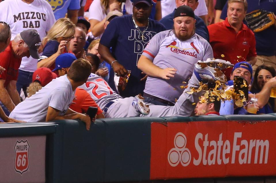 Addison Russell took out some nachos Monday night. (Photo by Dilip Vishwanat/Getty Images)