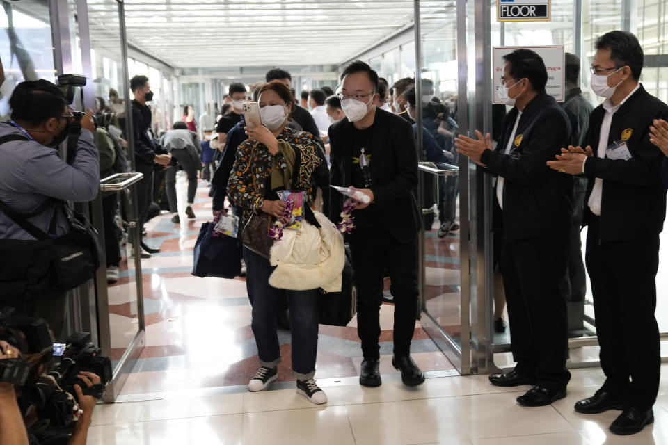 Chinese tourists arrive at Suvarnabhumi International Airport in Samut Prakarn province, Thailand, Monday, Jan. 9, 2023. Thailand is looking forward to hosting large numbers of vistors from China again after Beijing eased travel restrictions on Sunday. Chinese were about one-third of the total number of tourists visiting Thailand before the coronavirus pandemic, and the authorities hope they can help its lucrative tourism industry recover.(AP Photo/Sakchai Lalit)