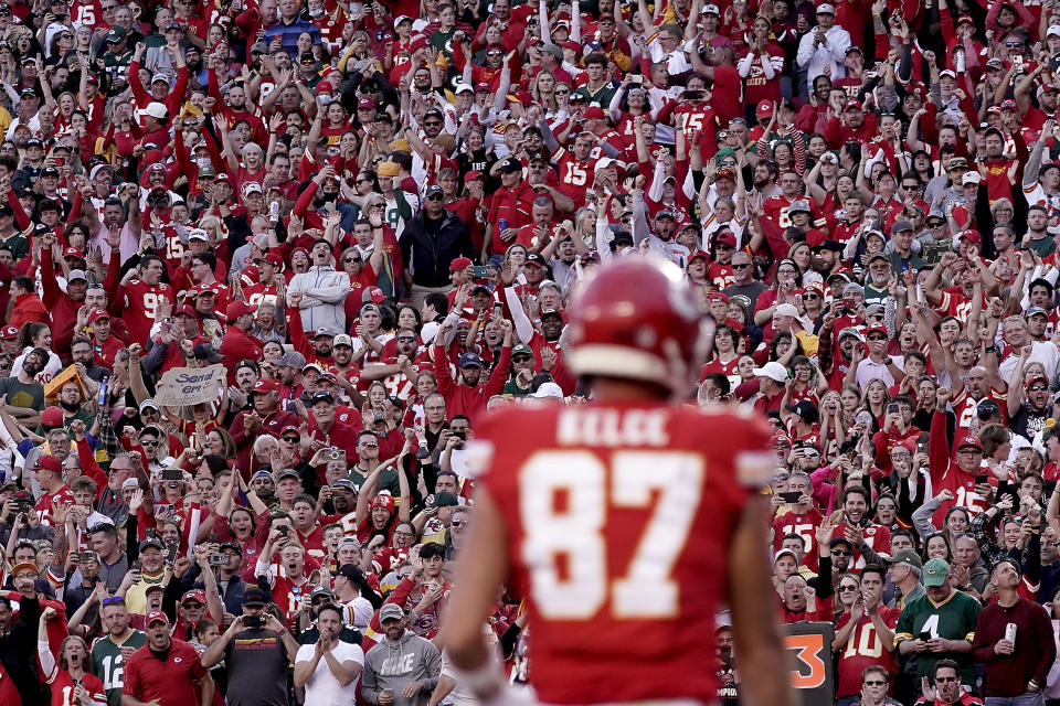 FILE - Fans cheer after Kansas City Chiefs tight end Travis Kelce (87) scored a touchdown during the first half of an NFL football game against the Green Bay Packers Sunday, Nov. 7, 2021, in Kansas City, Mo. Taylor Swift and Travis Kelce have remained mum about their status since the pop superstar began attending the Kansas City Chiefs tight end's football games. Still, the NFL wants in on the fun, with a team of folks monitoring social media to see where it could be part of the phenomenon as various memes and trends took off. (AP Photo/Charlie Riedel, File)