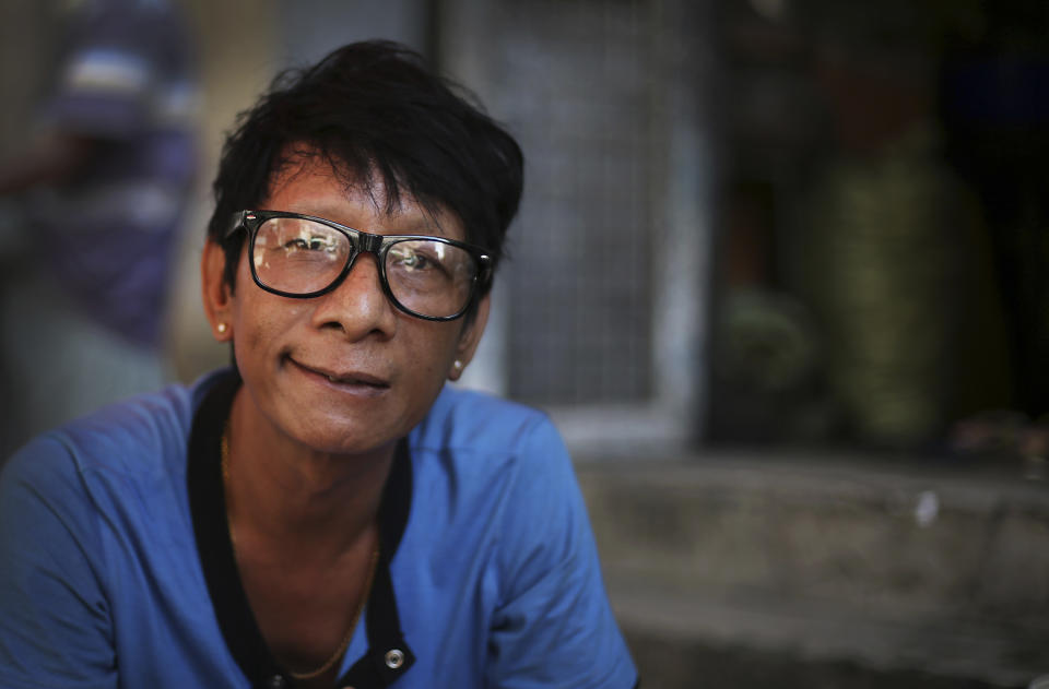 In this Tuesday, Aug. 13, 2013 photo, Kyaw Htoo, one of Myanmar's best-known comedians sits and waits for work in downtown Yangon, Myanmar. Myanmar's movie industry is organized in a unique way. Actors and actresses congregate - form unions, develop health-care plans, lobby for benefits - based on the roles they play on screen. There is an aging mothers' guild, a spinsters' guild, a comedians' guild. It is typecasting, pulled into the real world. These days, in the hierarchy of movie roles, comedians seem to fare better. Perhaps because Myanmar is hungry for laughter, not villainy, most movies made inside the country these days are comedies. Thus, those who make people smile are higher on the food chain. This is of no small import to the villains, befuddled by a world where the jokester outpaces the scoundrel. (AP Photo/Wong Maye-E)