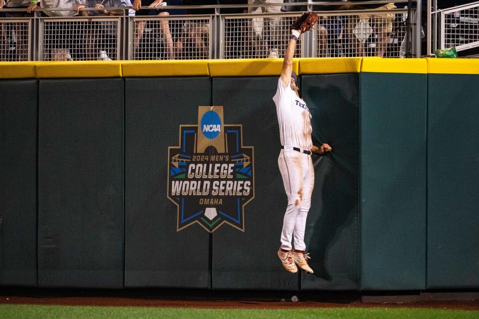 Texas A&M right fielder Jace Laviolette robs the Florida of a home run in the ninth inning at Charles Schwab Field Omaha.