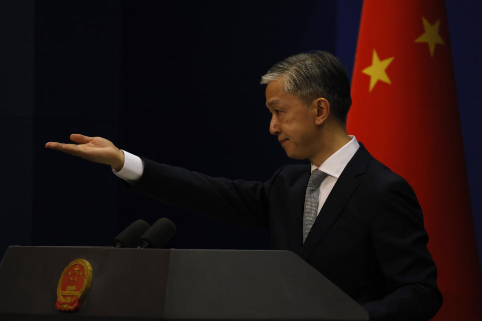 Foreign Ministry spokesperson Wang Wenbin gestures for questions during a daily briefing in Beijing Thursday, July 23, 2020. China ordered the United States on Friday, July 24, 2020 to close its consulate in the western city of Chengdu, ratcheting up a diplomatic conflict at a time when relations have sunk to their lowest level in decades. (AP Photo/Ng Han Guan)