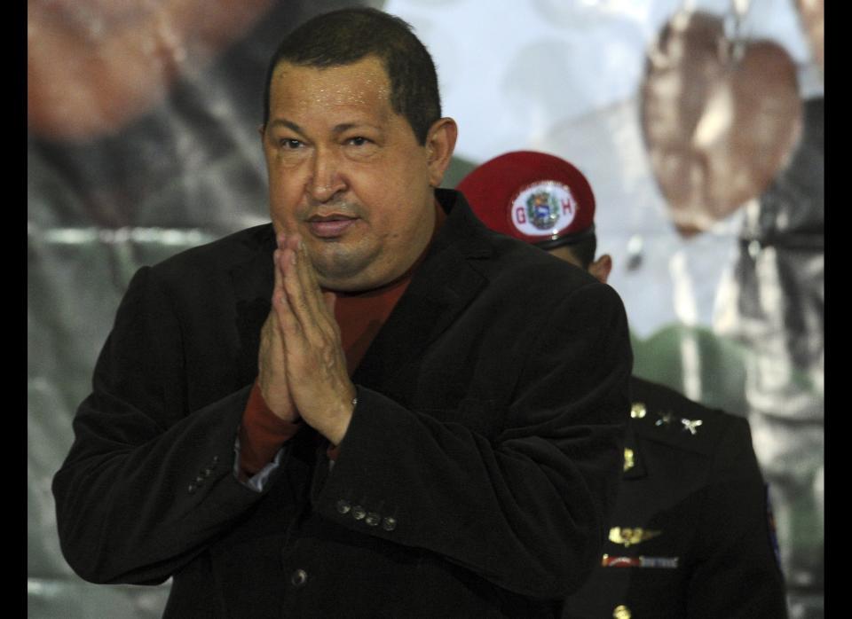 Venezuelan president Hugo Chavez gestures during a ceremony with elderly in Caracas on January 24, 2012.  AFP PHOTO/JUAN BARRETO (Photo credit should read JUAN BARRETO/AFP/Getty Images)