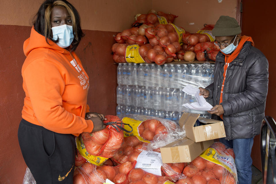 BROOKLYN, NY - APRIL 23: Volunteers at the food pantry Bed Stuy Campaign Against Hunger distribute free food to local residents during the COVID-19 pandemic on April 23, 2020 in the Bedford-Stuyvesant neighborhood of Brooklyn, New York. Due to increased levels of unemployment, the lines at the daily food pantry have been getting longer. (Photo by Andrew Lichtenstein/Corbis via Getty Images)