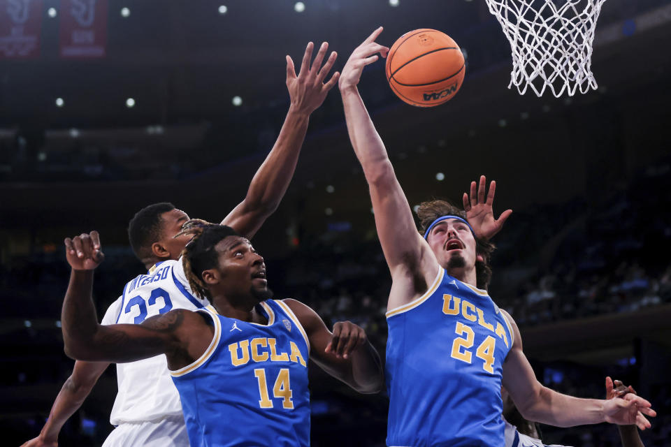 UCLA guard Jaime Jaquez Jr. (24) shoots during the first half of an NCAA college basketball game against Kentucky in the CBS Sports Classic, Saturday, Dec. 17, 2022, in New York. (AP Photo/Julia Nikhinson)