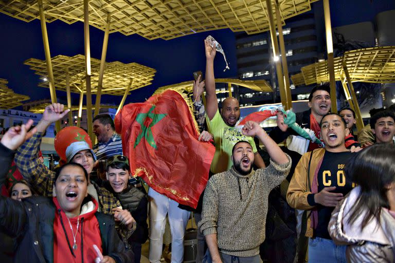 RABAT, MOROCCO - DECEMBER 6: Moroccan supporters celebrate victory as Morocco qualified for 2022 FIFA World Cup quarterfinals after beating Spain on penalties during the FIFA World Cup Qatar 2022 Round of 16 match between Morocco and Spain in Rabat, Morocco on December 6, 2022. (Photo by Jalal Morchidi/Anadolu Agency via Getty Images)