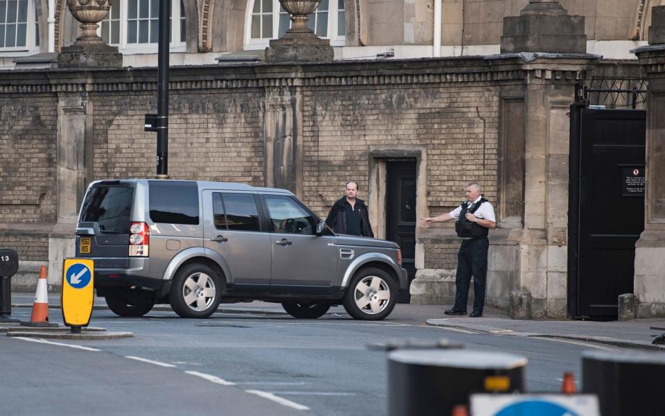 A car carrying the Prime Minister arrives at a side entrance to Buckingham Palace -  London News Pictures