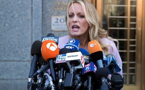 Adult film actress Stormy Daniels, speaking outside court on Monday 16 April  - Credit: Mary Altaffer/AP