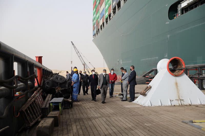 Osama Rabie, Chairman of the Suez Canal Authority, walks as he monitors the situation near stranded container ship Ever Given, one of the world's largest container ships, after it ran aground, in Suez Canal