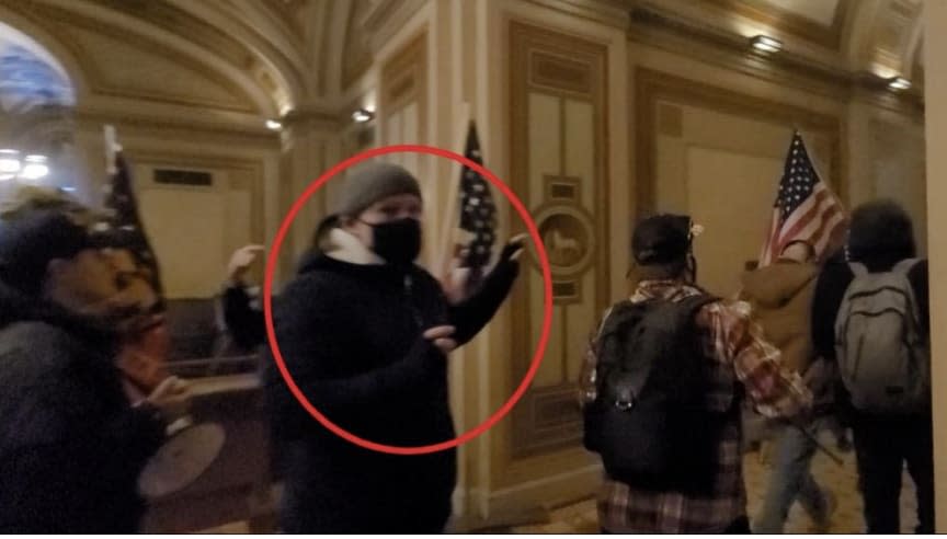 Michael Hennessey wearing a black mask and beanie in the U.S. Capitol.