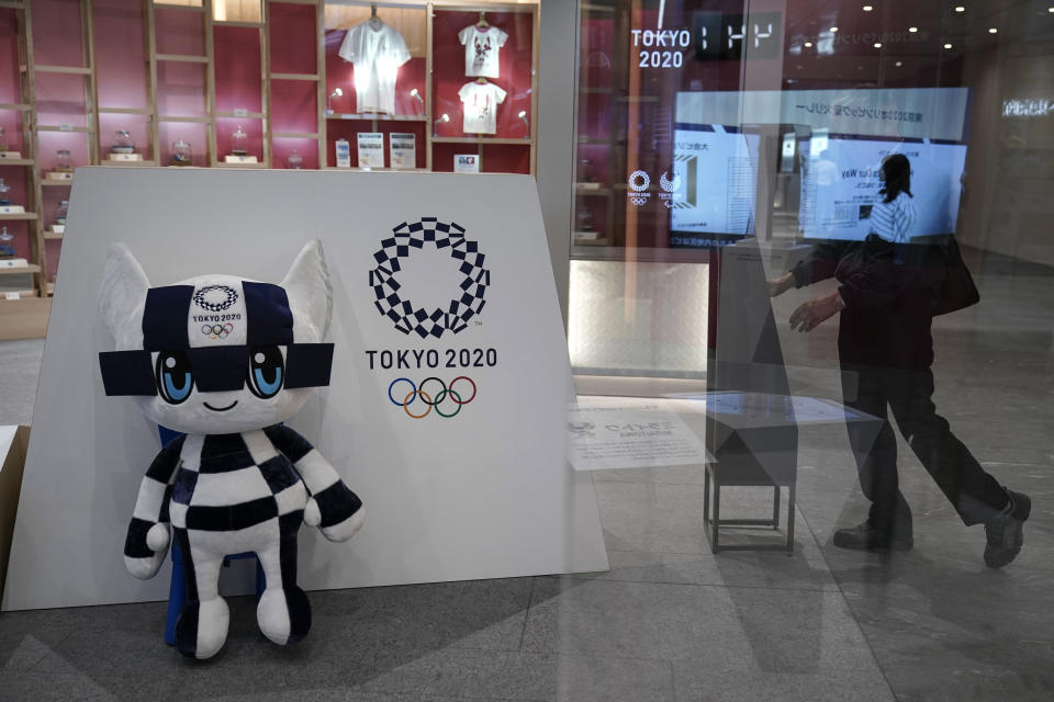 FILE - In this June 11, 2019, file photo, Miraitowa, a mascot for the Tokyo 2020 Summer Olympics, is displayed at an Olympic Corner in Tokyo. Scandals and rising costs have not deterred interest in Japan in the Tokyo Olympic. They open in a year with unprecedented ticket demand. (AP Photo/Jae C. Hong, File)