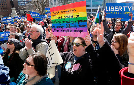 FILE PHOTO: Demonstrators gather at Monument Circle to protest a controversial religious freedom bill recently signed by Governor Mike Pence during a rally in Indianapolis March 28, 2015. More than 2,000 people gathered at the Indiana State Capital Saturday to protest Indiana's newly signed Religious Freedom Restoration Act saying it would promote discrimination against individuals based on sexual orientation. REUTERS/Nate Chute/File Photo