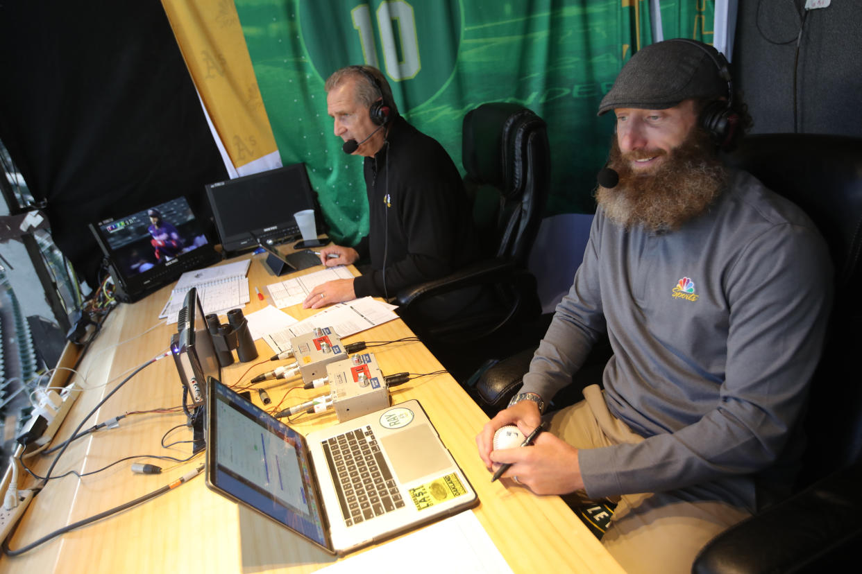 OAKLAND, CA - MAY 17: Broadcasters Glen Kuiper and Dallas Braden of the Oakland Athletics in the TV booth during the game against the Minnesota Twins at RingCentral Coliseum on May 17, 2022 in Oakland, California. The Athletics defeated the Twins 5-2. (Photo by Michael Zagaris/Oakland Athletics/Getty Images)