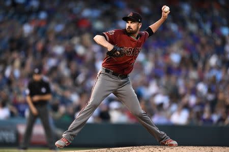 Jul 11, 2018; Denver, CO, USA; Arizona Diamondbacks relief pitcher T.J. McFarland (30) delivers a pitch in the third inning against the Colorado Rockies at Coors Field. Mandatory Credit: Ron Chenoy-USA TODAY Sports