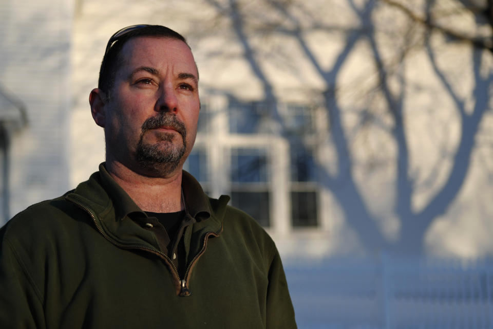 In this Tuesday, March 12, 2019 photo, former SWAT officer Al Joyce poses in Norway, Maine. Joyce left his job in law enforcement in Jefferson County, Colo., after a school shooting and now works as a cashier. Joyce was part of the team that in 2006 stormed a classroom in Platte Canyon High School in the town of Bailey, southwest of Denver and saw the aftermath of a shooting. It wasn't long before the nightmares began and he started drinking heavily to avoid them. He ended up leaving the SWAT team, divorcing his wife and withdrawing from the world. "I wanted to just shut down, turn off," he said. "It didn't work out so well."(AP Photo/Robert F. Bukaty)