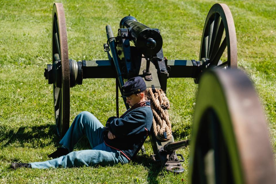 A re-enactor naps during a special Civil War School Days event for school-aged children, Friday, Sept. 15 in Zoar.