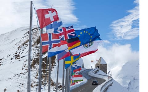 Flags beside mountain road - Credit: Naturfoto-Online/Alamy