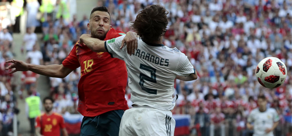<p>Jordi Alba and Russia’s Mario Fernandes challenge for the ball </p>