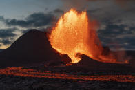 Lava flows from an eruption of the Fagradalsfjall volcano on the Reykjanes Peninsula in southwestern Iceland on Tuesday, May 11, 2021. (AP Photo/Miguel Morenatti)