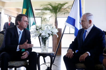 Brazil's President-elect Jair Bolsonaro talks with Israeli Prime Minister Benjamin Netanyahu during a meeting in Rio de Janeiro, Brazil December 28, 2018. Fernando Frazao/Courtesy of Agencia Brasil/Handout via REUTERS