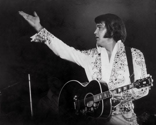 Elvis Presley performs during a March 20, 1974, concert at the Mid-South Coliseum in Memphis. Elvis ended a 15-city tour with three performances in his hometown.