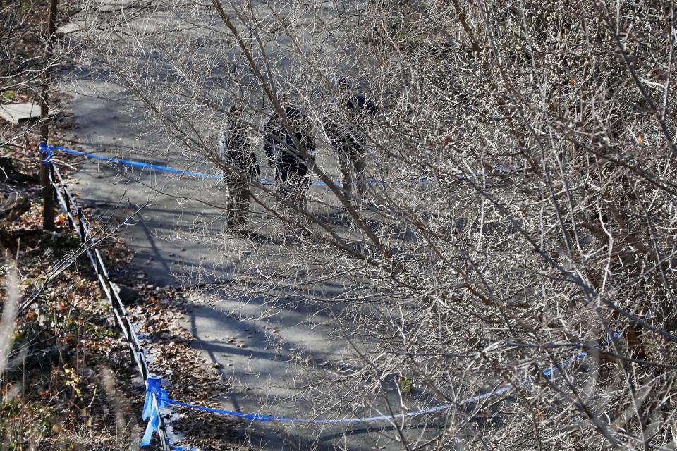 New York City Police Dept. officers work a crime scene in Morningside Park along Manhattan's Upper West Side, Thursday, Dec. 12, 2019, in New York. An 18-year-old Barnard College freshman, identified as Tessa Majors, has been fatally stabbed during an armed robbery in the park, sending shock waves through the college and wider Columbia University community. (AP Photo/Richard Drew)